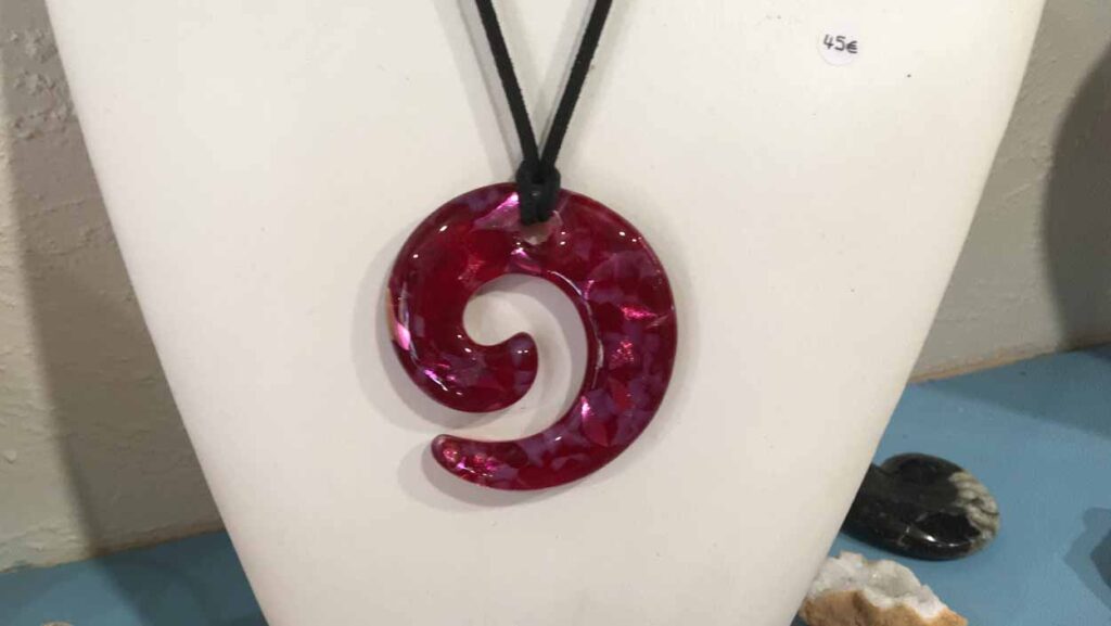 Fused glass red curl.jpeg